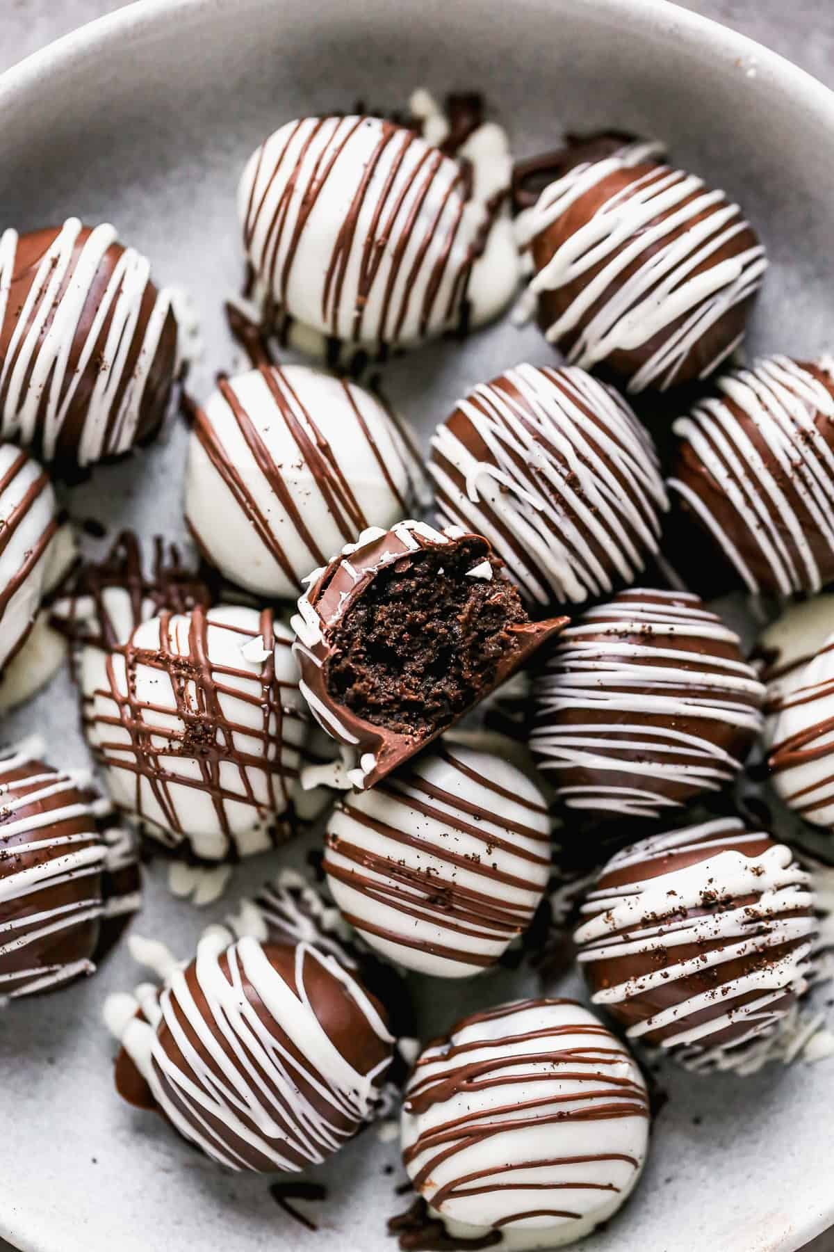 Oreo balls are a chocolate-dipped crowd-pleaser that kids love to help make.